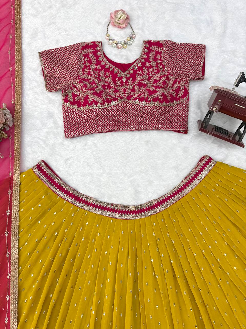 Vibrant Sunshine Yellow and Fuchsia Pink Designer Lehenga Choli with Dazzling Shimmer Embellishments